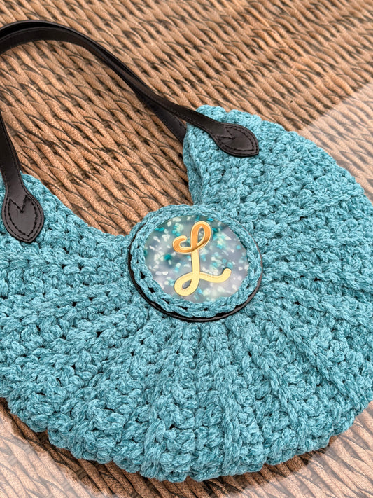 Bolso redondo con asa de Cuero negro